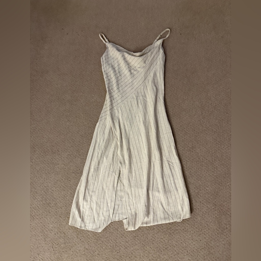 Aakaa brand women’s beige dress with black pin stripes. Mid length. Size small.